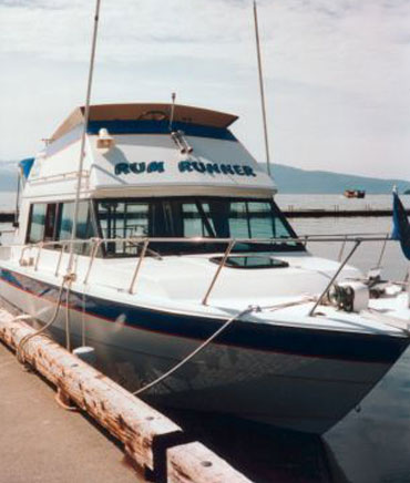 The Rum Runner 31-ft cabin cruiser for Juneau Whale Watching and Sport Fishing Tours